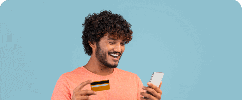 Grid Container Block For WordPress happy-indian-guy-holding-cell-phone-credit-card 1